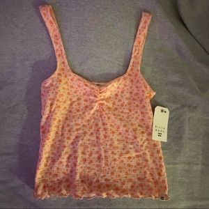 Billabong cropped tank, size large but fits like a medium.